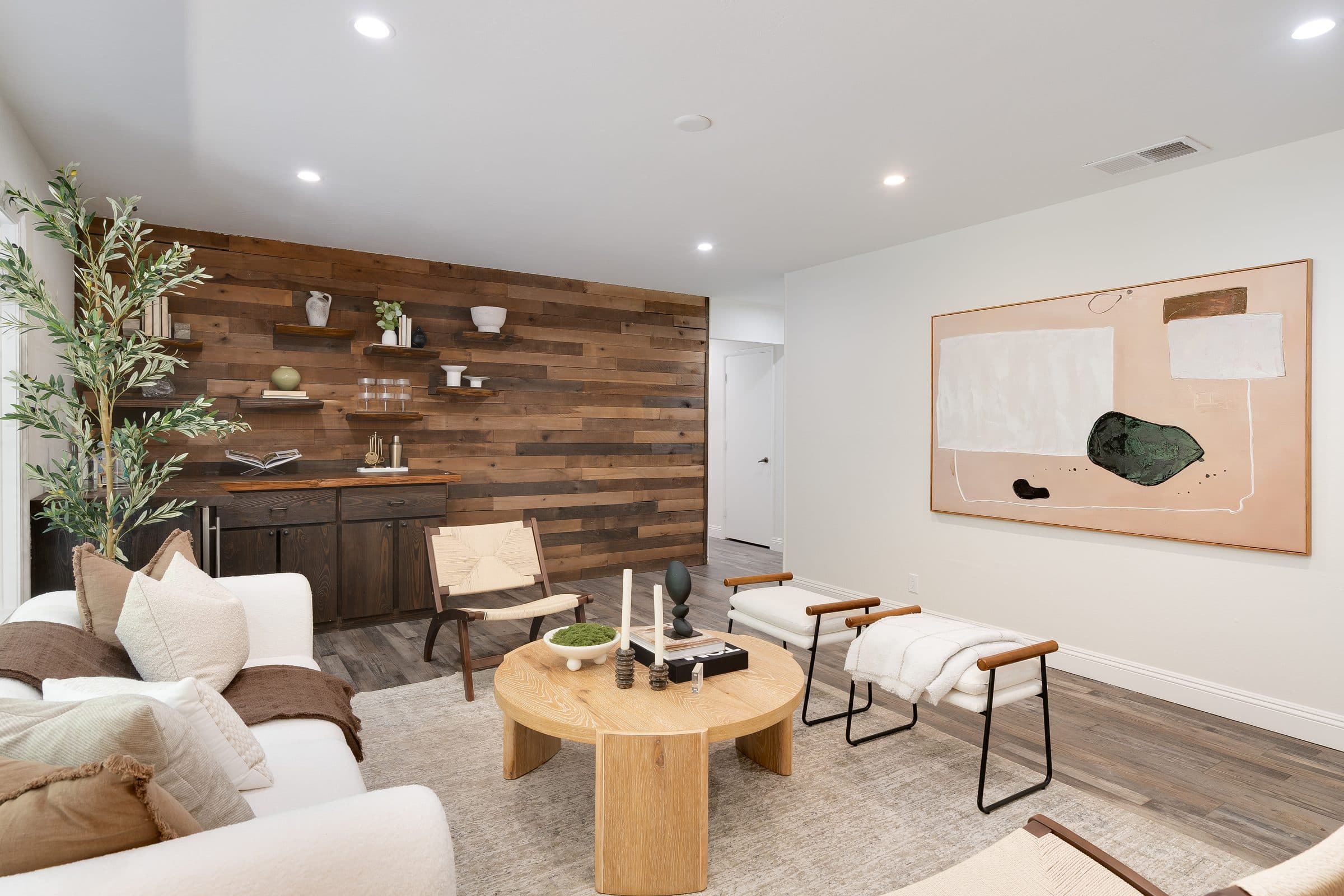 48 Kingston Place. The living room and its wood-paneled wall.