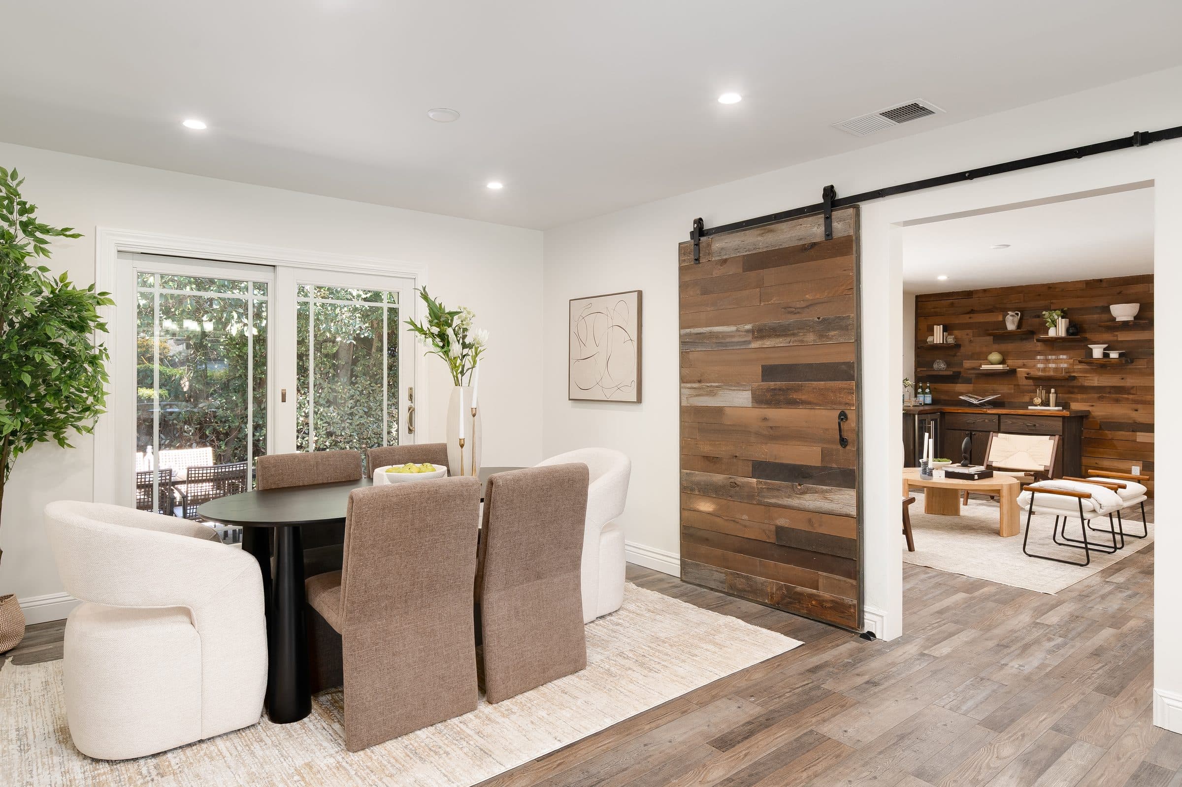 48 Kingston Place. The dining area, its barn door open to the living room.