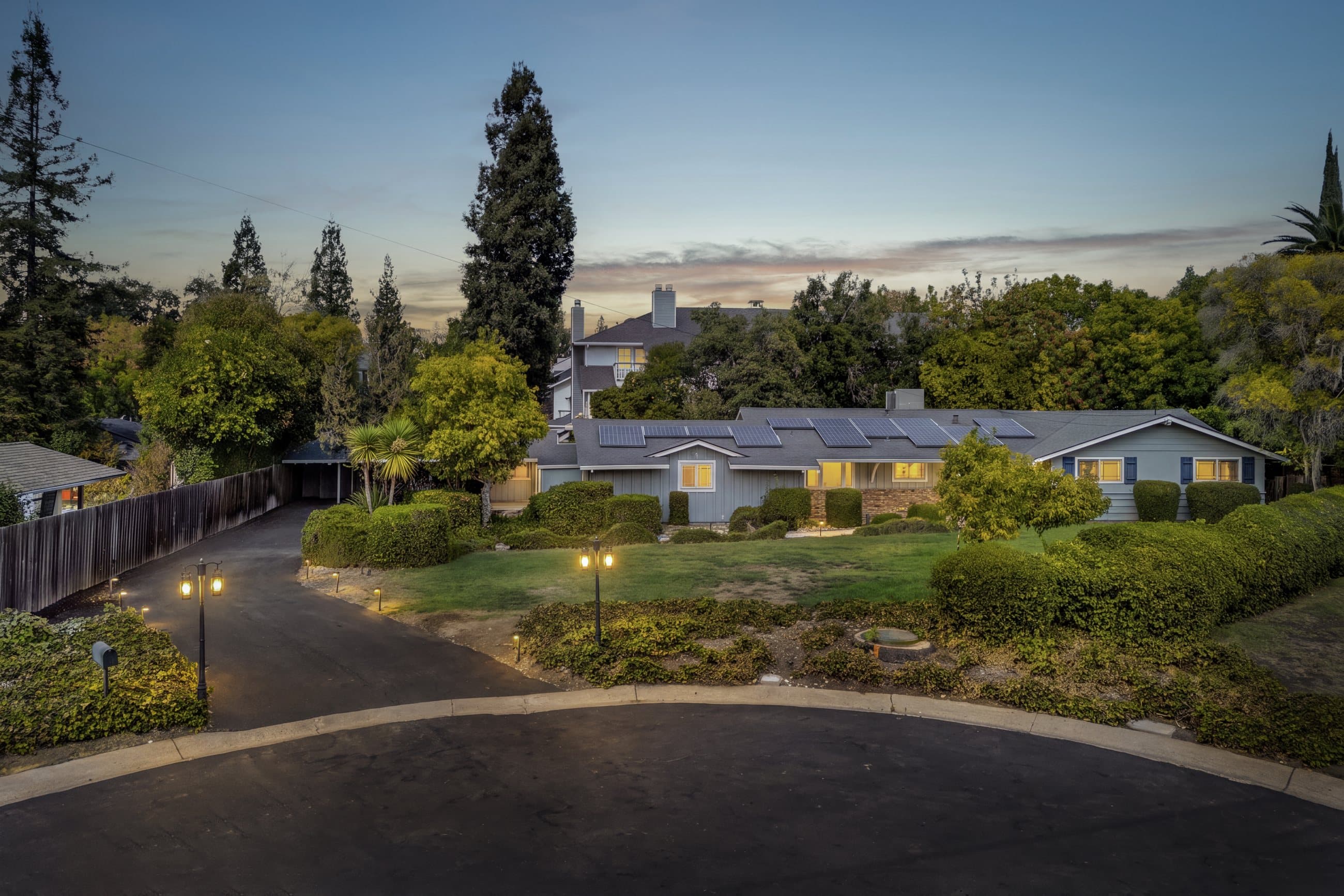 48 Kingston Place at dusk, across the front lawn and driveway from the cul-de-sac.