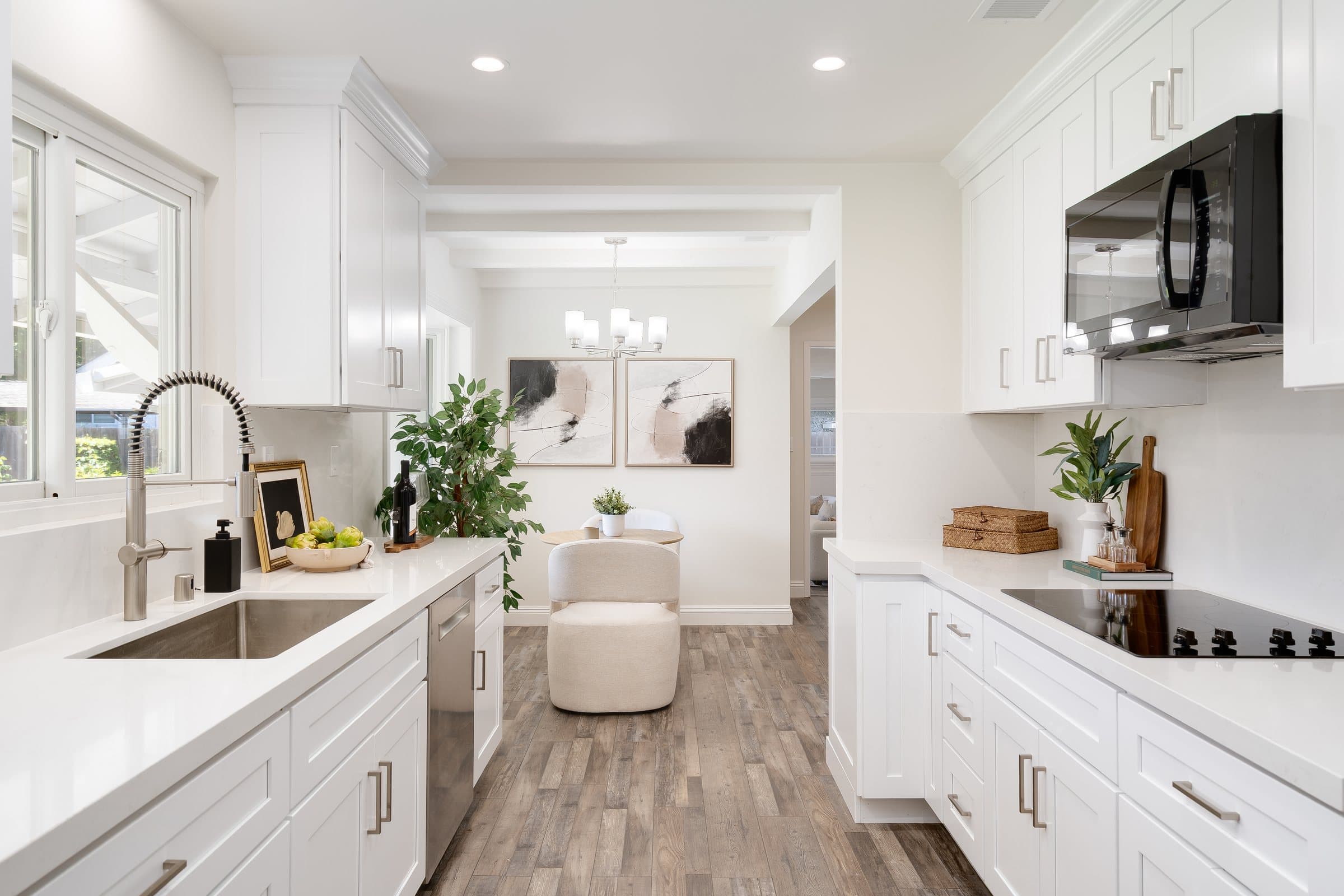 The updated kitchen at 48 Kingston Place, with white cabinetry and stainless appliances.